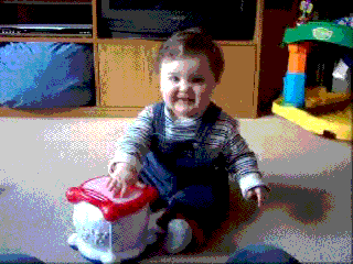 baby hitting drum
